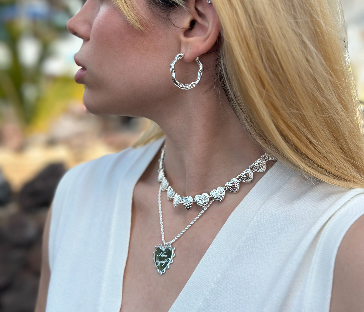 I love myself necklace 925 sterling silver alterego chunky jewelry in model. Irregular circle halo hoops earrings and strawberry hearts necklace